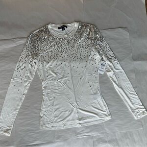 Woman’s white sparkling top
